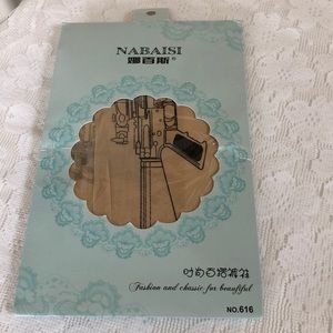 Beige/natural tights with machine gun design.